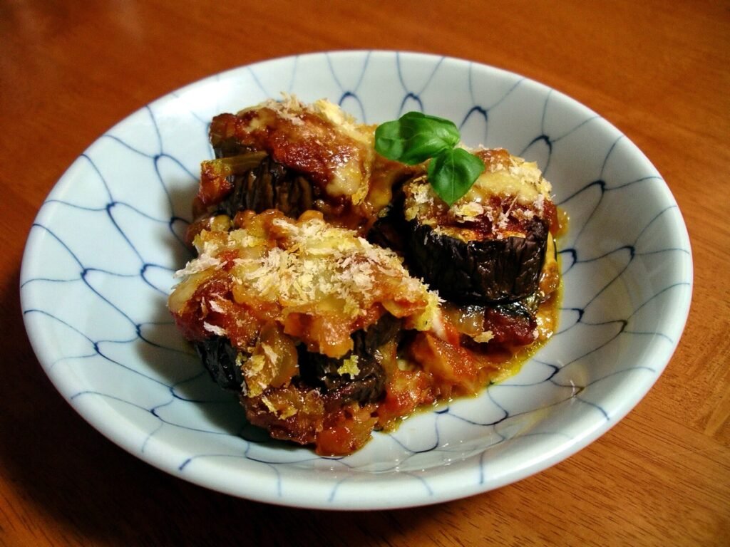 Parmigiana di melanzane, porzione di melanzane alla parmigiana